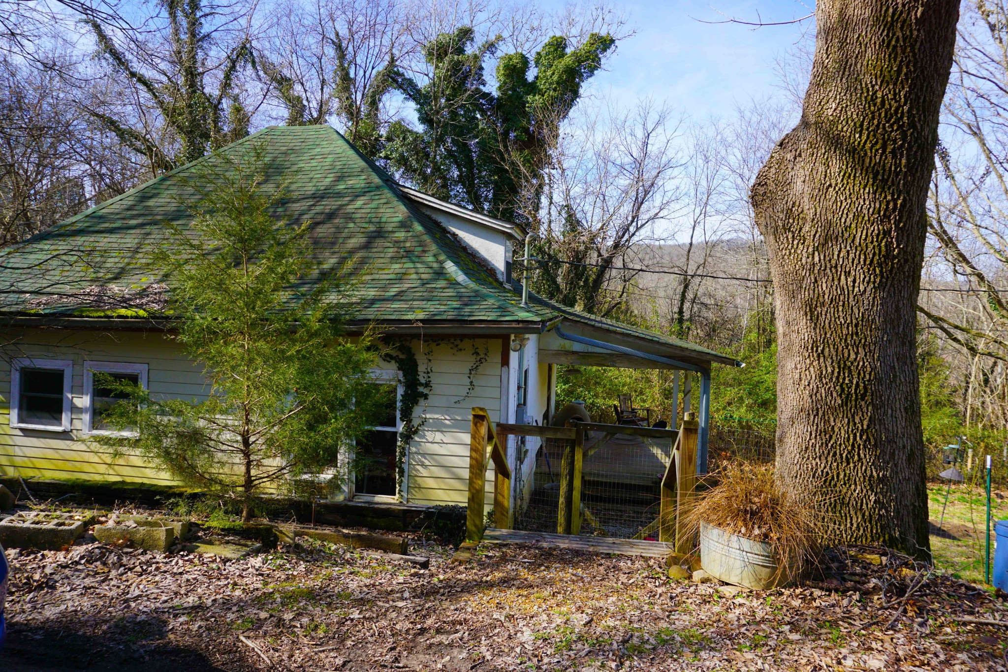 140 Hoot Owl Hollow Road Watertown, TN 37184 - Photo 1 of 21 a front view of a house with garden