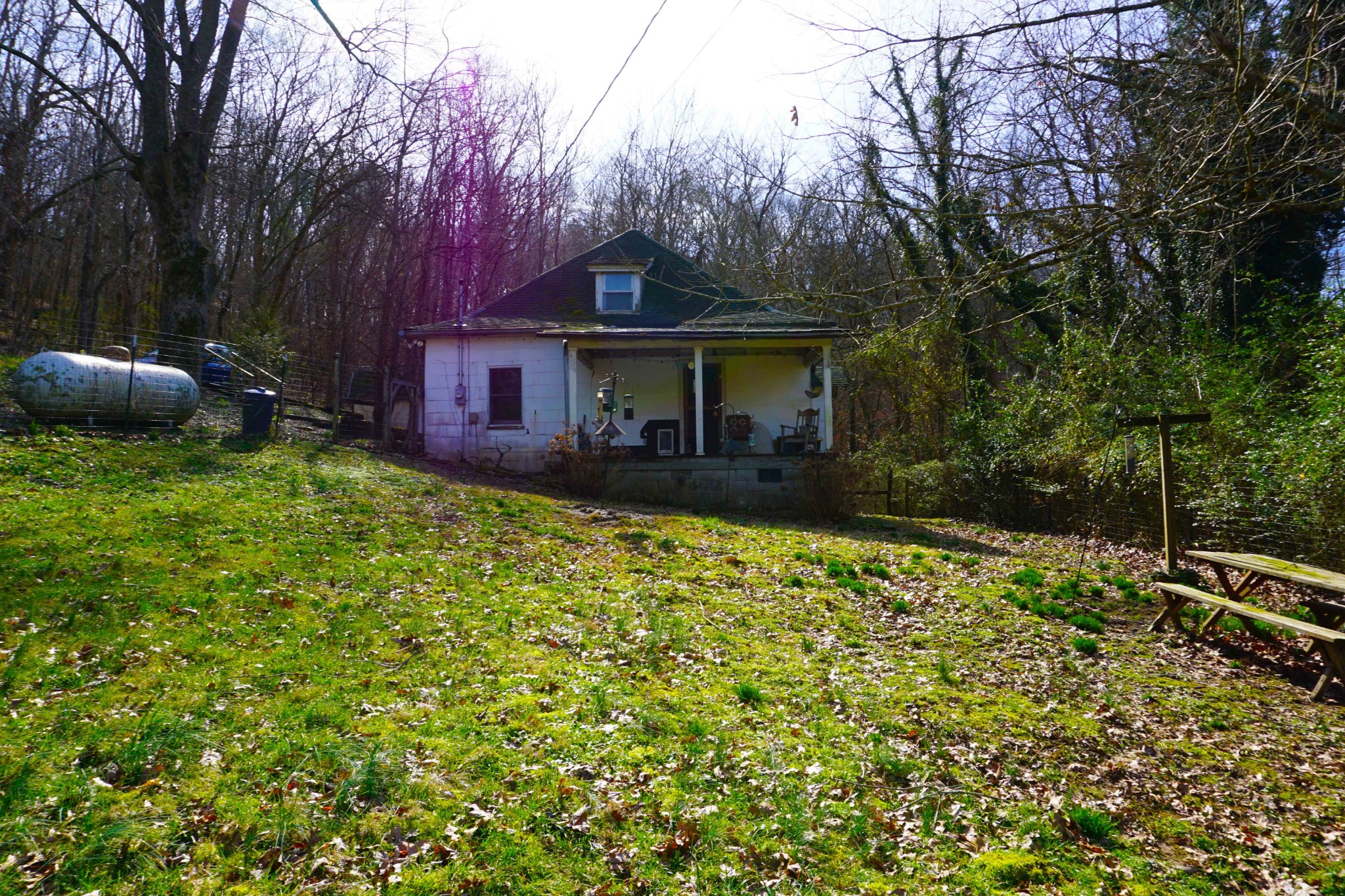 140 Hoot Owl Hollow Road Watertown, TN 37184 - Photo 3 of 21 a backyard of a house with table and chairs and potted plants
