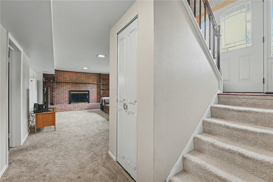 4919 Silver Arrow Drive Riverside, OH 45424 - Photo 34 of 57 This inviting space features a cozy fireplace, perfect for relaxation and intimate gatherings.