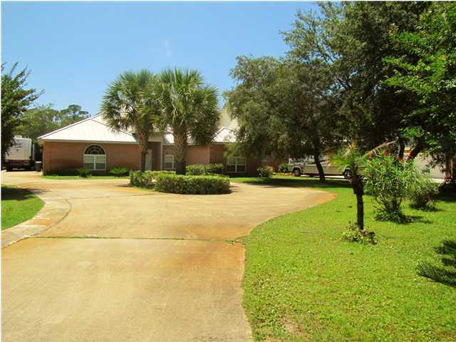 64 Windy Way Santa Rosa Beach, FL 32459 - Photo 1 of 20 a view of yard with swimming pool and trees