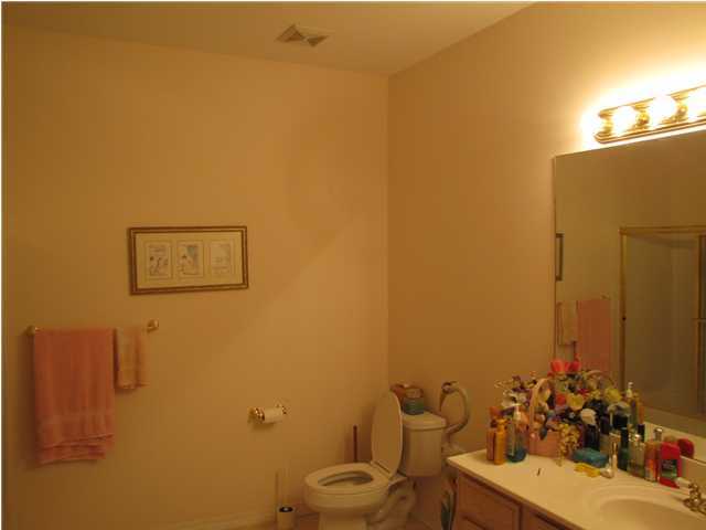 64 Windy Way Santa Rosa Beach, FL 32459 - Photo 4 of 20 a bathroom with a toilet sink and mirror