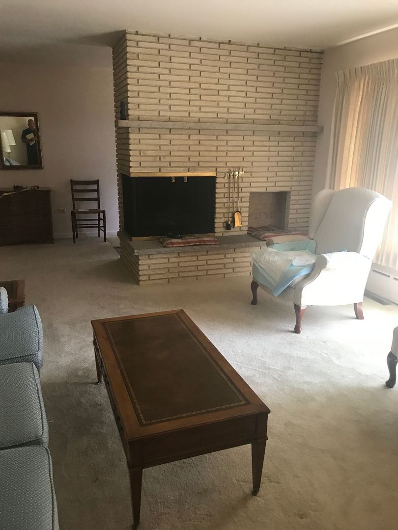2110 Beechnut Road Northbrook, IL 60062 - Photo 8 of 10 a living room with furniture and a fireplace