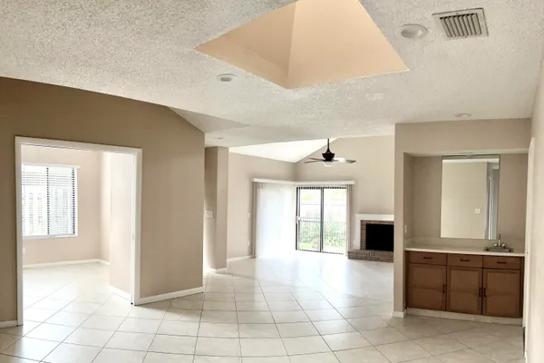a view of an entryway of a house and a livingroom