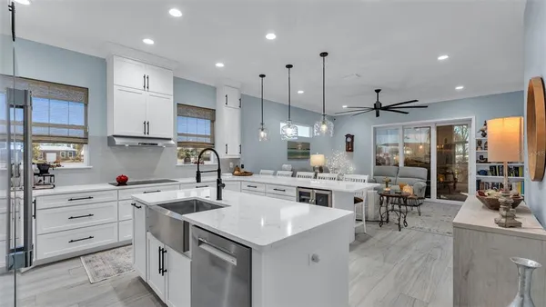 a kitchen with white cabinets stove and refrigerator