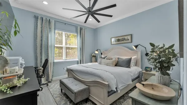 a bedroom with a bed and a couch