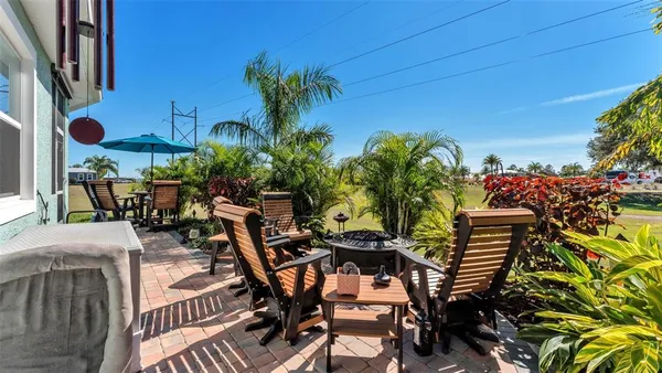 a view of a chairs and table in the patio