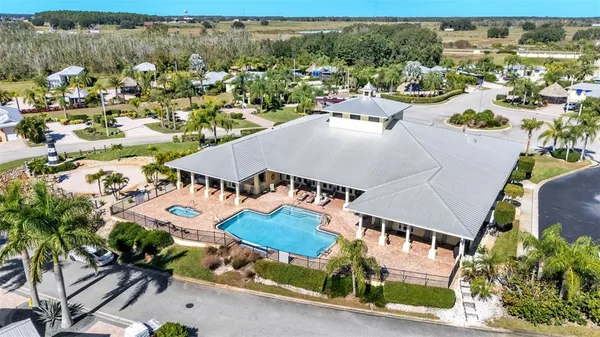 an aerial view of residential houses and outdoor space