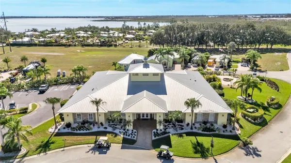 a view of a swimming pool with a table and chairs