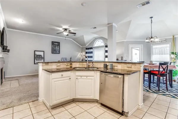 a kitchen with a sink and cabinets