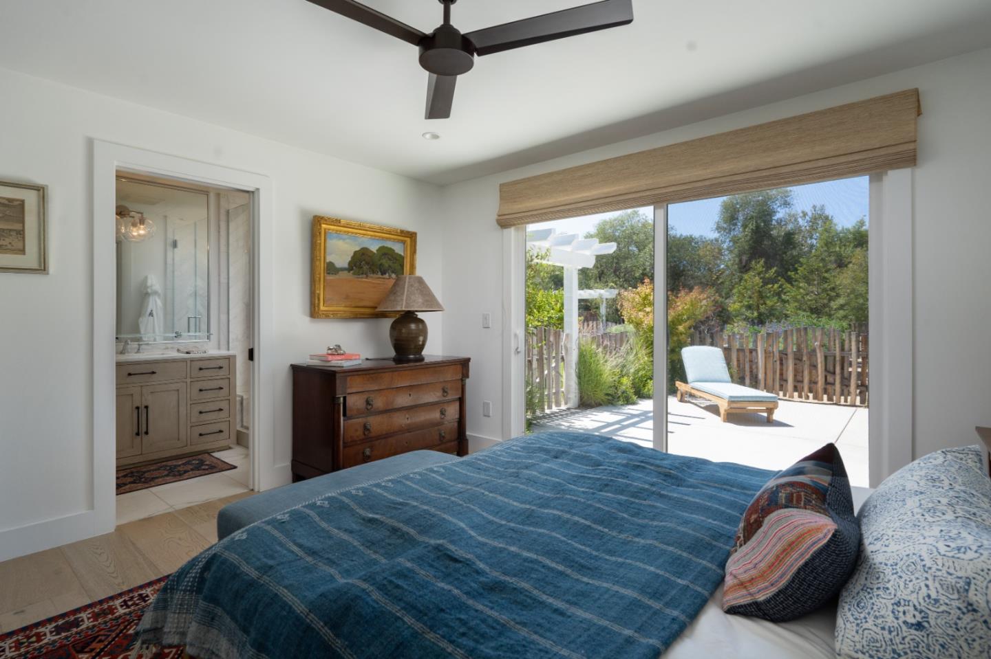 28060 Robinson Canyon Road Carmel, CA 93923 - Photo 12 of 36 a bedroom with a bed and large windows