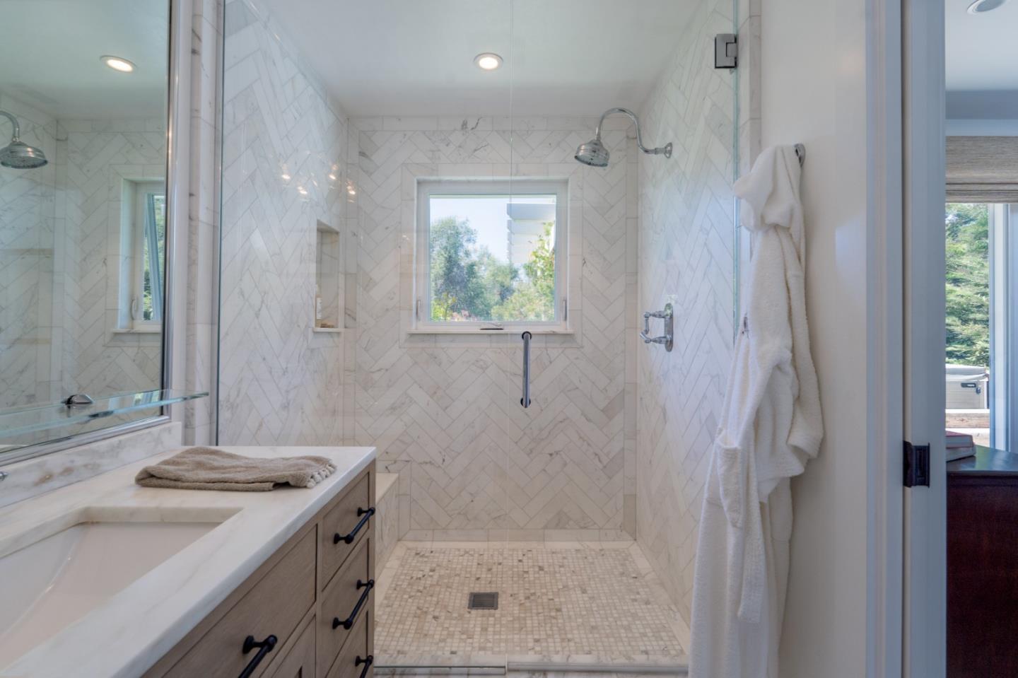 28060 Robinson Canyon Road Carmel, CA 93923 - Photo 14 of 36 a bathroom with a granite countertop sink a shower and a mirror