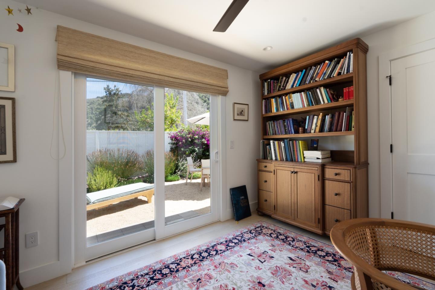 28060 Robinson Canyon Road Carmel, CA 93923 - Photo 16 of 36 a room with a bookshelf and a window