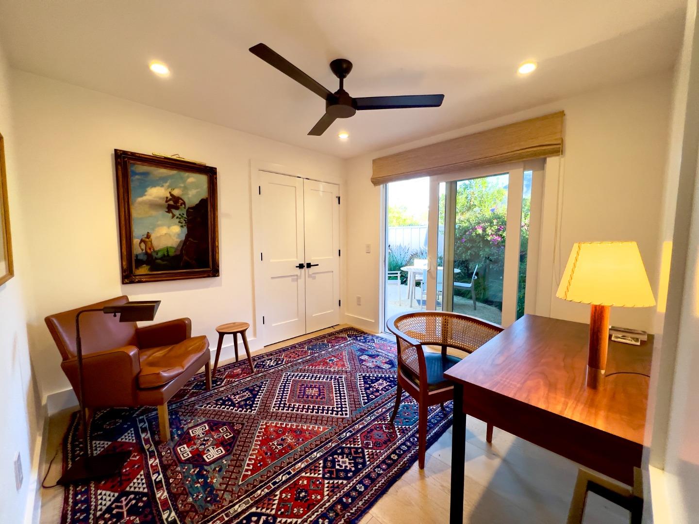 28060 Robinson Canyon Road Carmel, CA 93923 - Photo 18 of 36 a living room with furniture a window and a flat screen tv