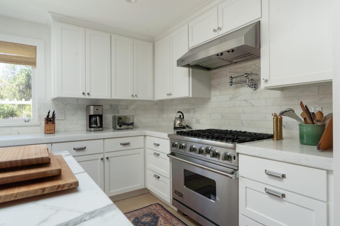 28060 Robinson Canyon Road Carmel, CA 93923 - Photo 21 of 36 a kitchen with cabinets appliances and a window