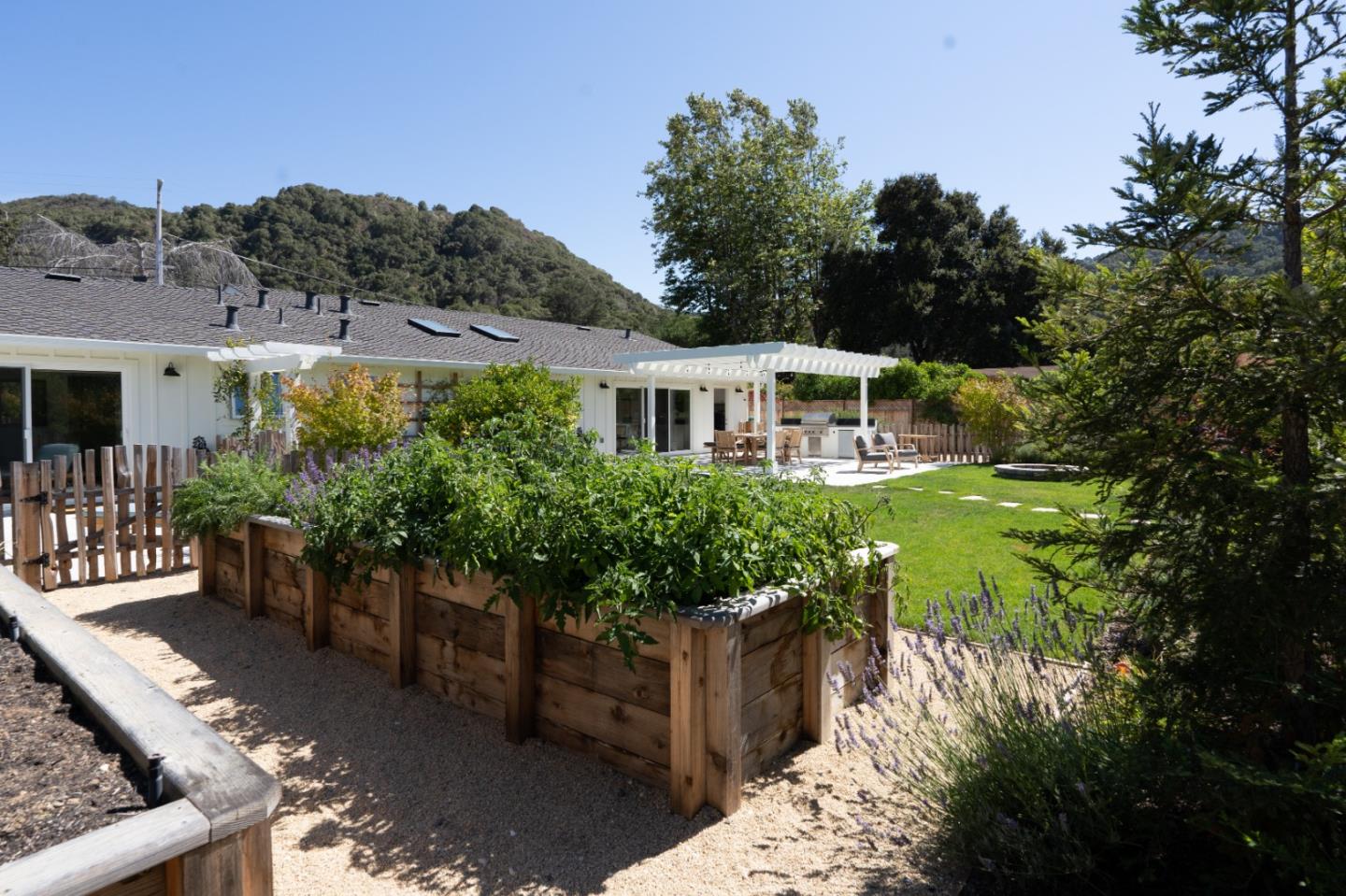 28060 Robinson Canyon Road Carmel, CA 93923 - Photo 27 of 36 a view of a house with a yard and sitting area