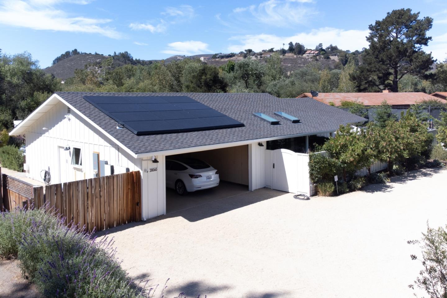 28060 Robinson Canyon Road Carmel, CA 93923 - Photo 30 of 36 a view of a house with a yard and wooden fence