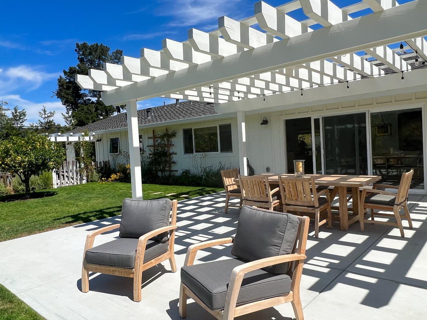 28060 Robinson Canyon Road Carmel, CA 93923 - Photo 36 of 36 a view of a patio with couches table and chairs with garden view