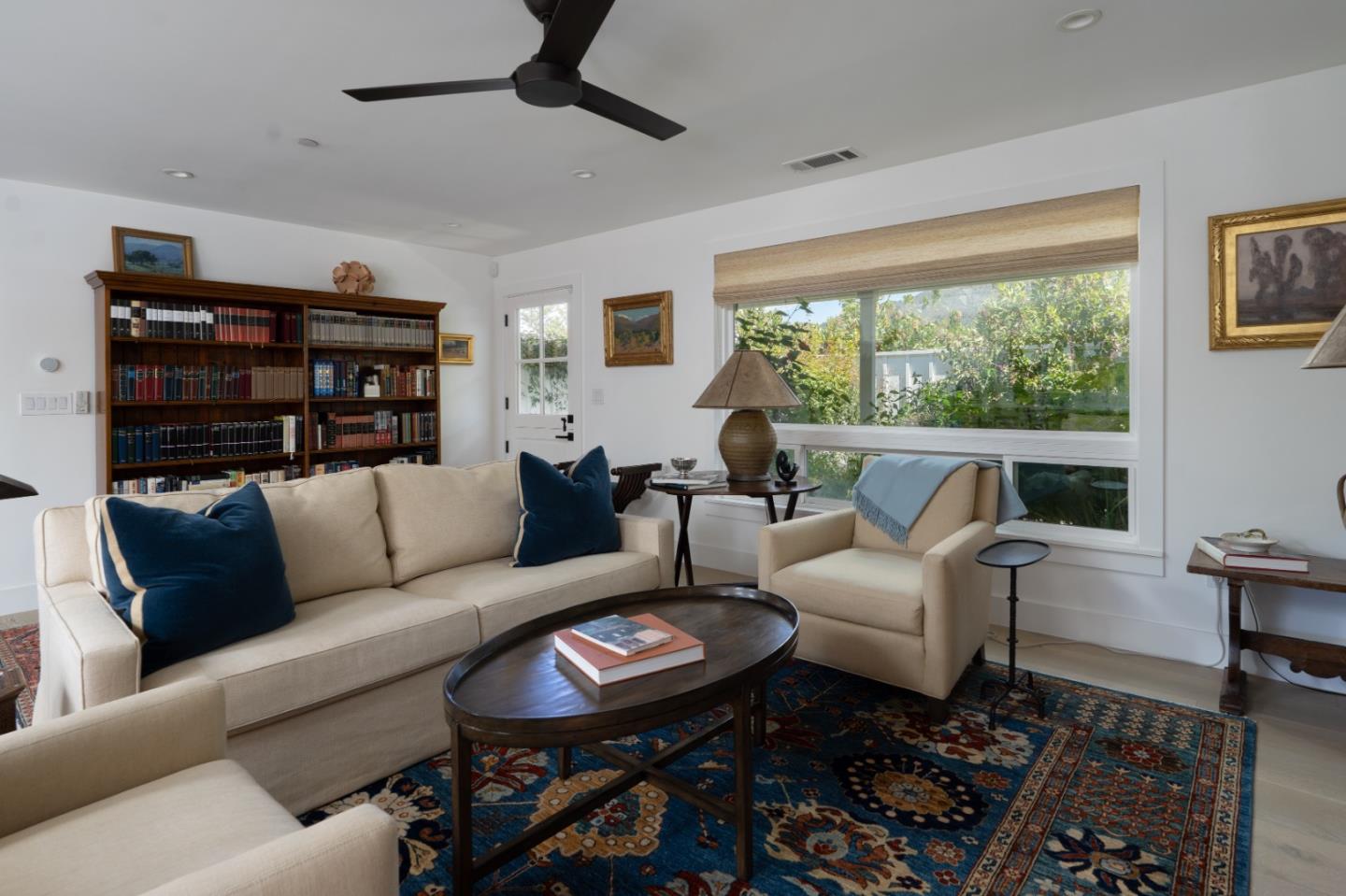 28060 Robinson Canyon Road Carmel, CA 93923 - Photo 4 of 36 a living room with furniture a ceiling fan and a large window