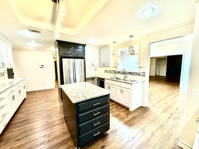 a kitchen with a stove a refrigerator and a stove