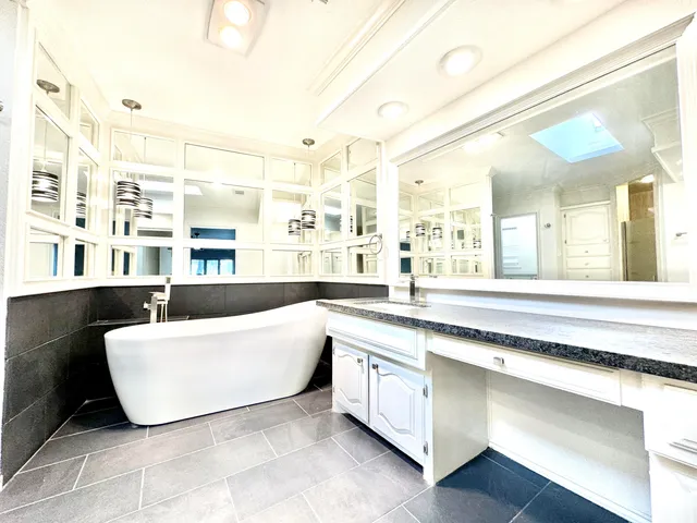 a living room with granite countertop furniture and a large window