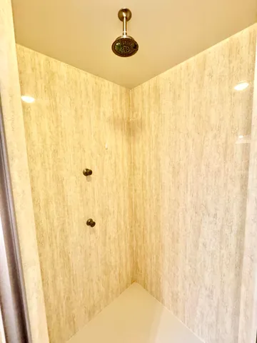 a bathroom with a shower curtain and a window