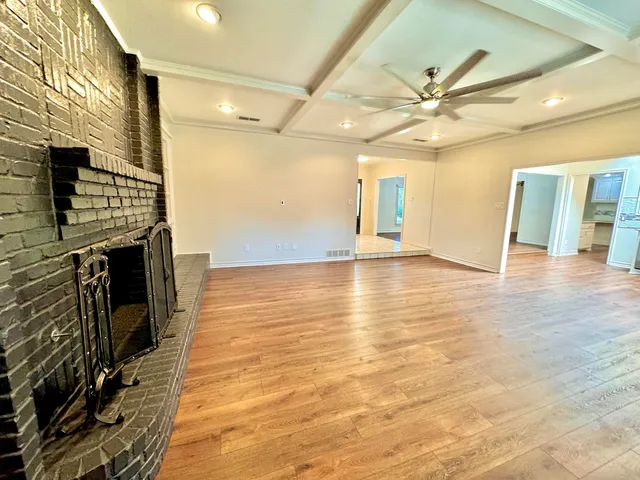 a view of a livingroom with wooden floor