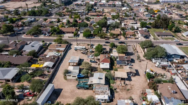 an aerial view of residential houses with outdoor space