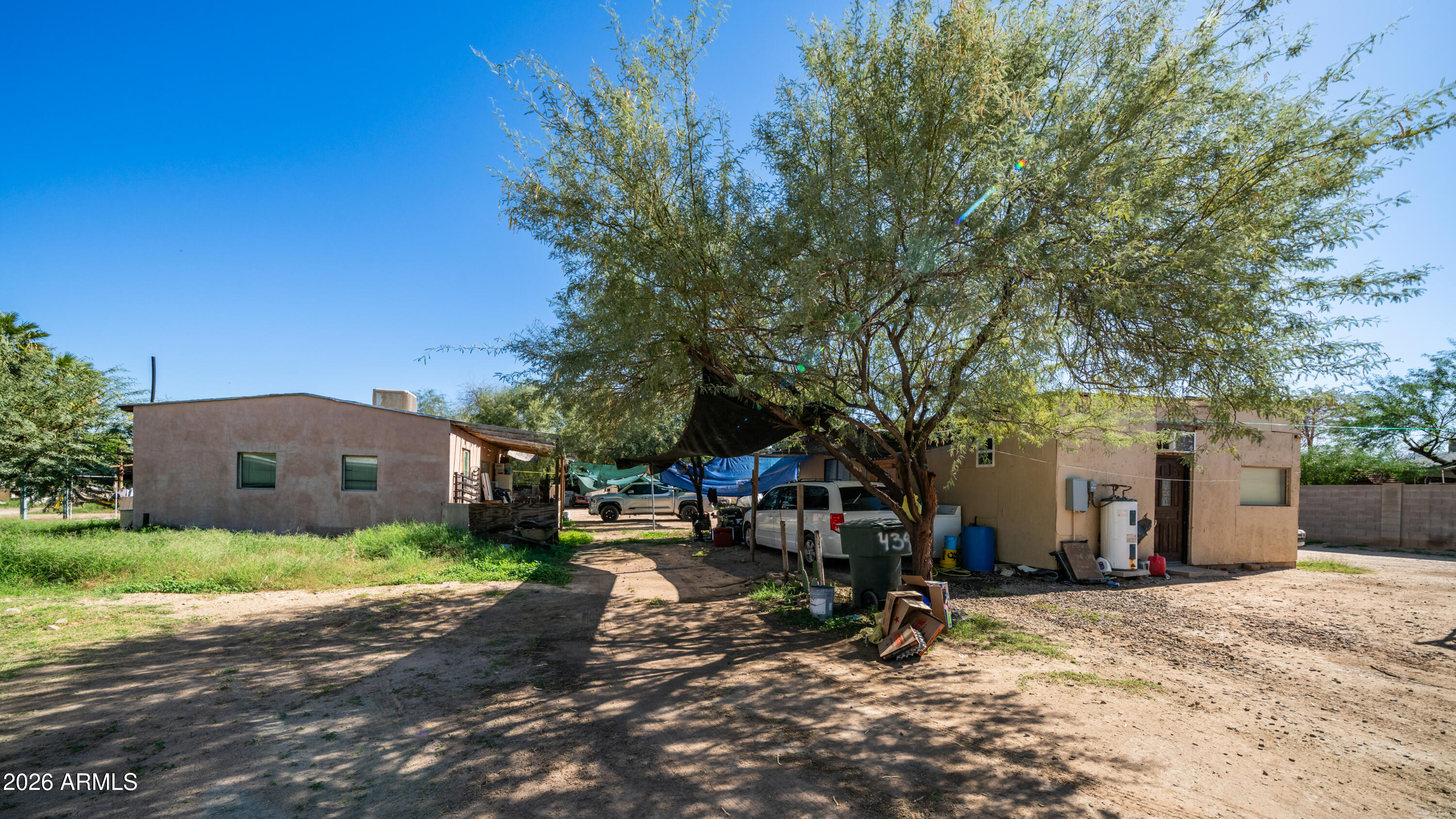 5437 South 4th Street Phoenix, AZ 85040 - Photo 24 of 28 a view of a house with a yard and large tree