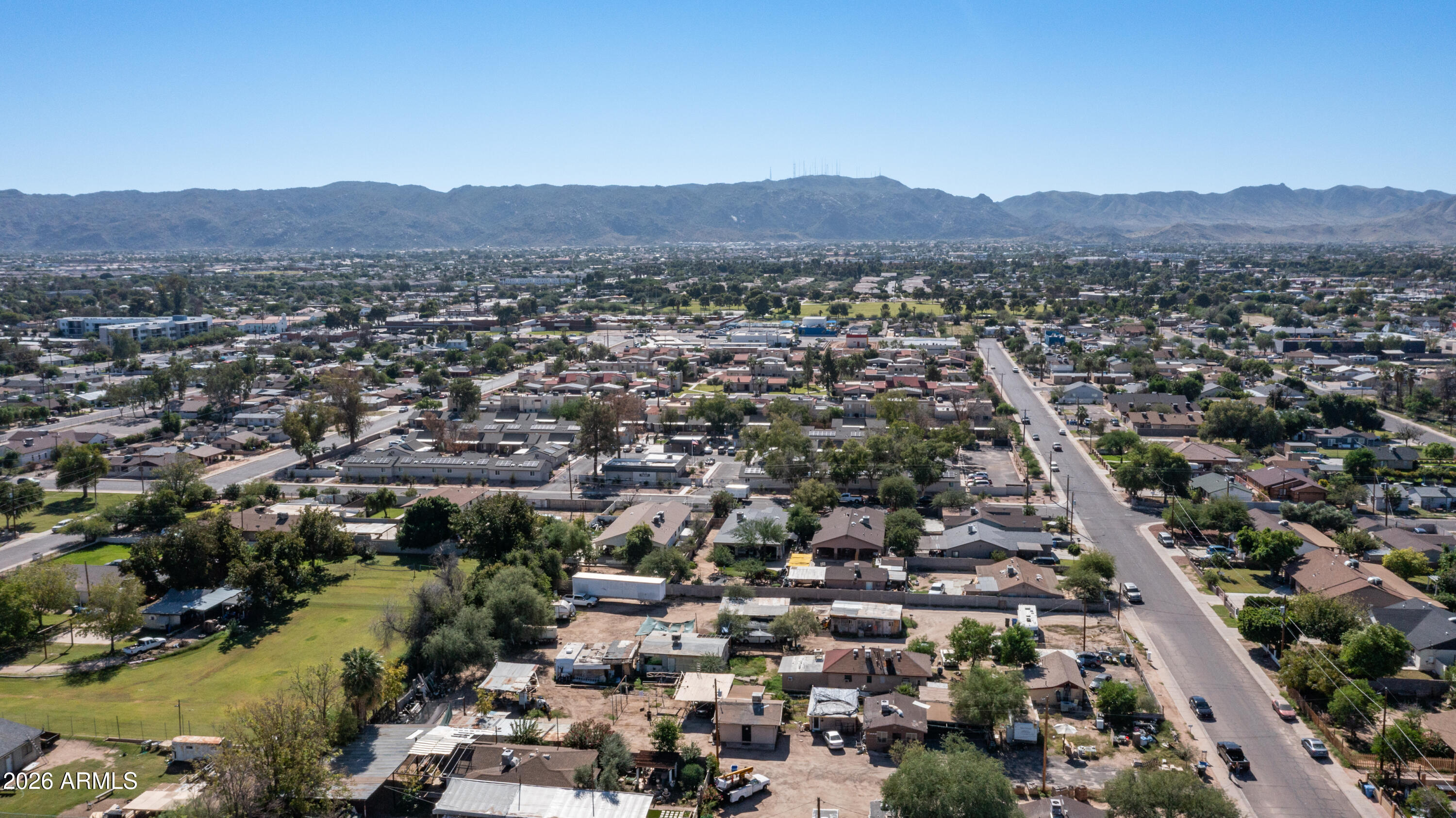 5437 South 4th Street Phoenix, AZ 85040 - Photo 8 of 28 an aerial view of residential houses with outdoor space and trees