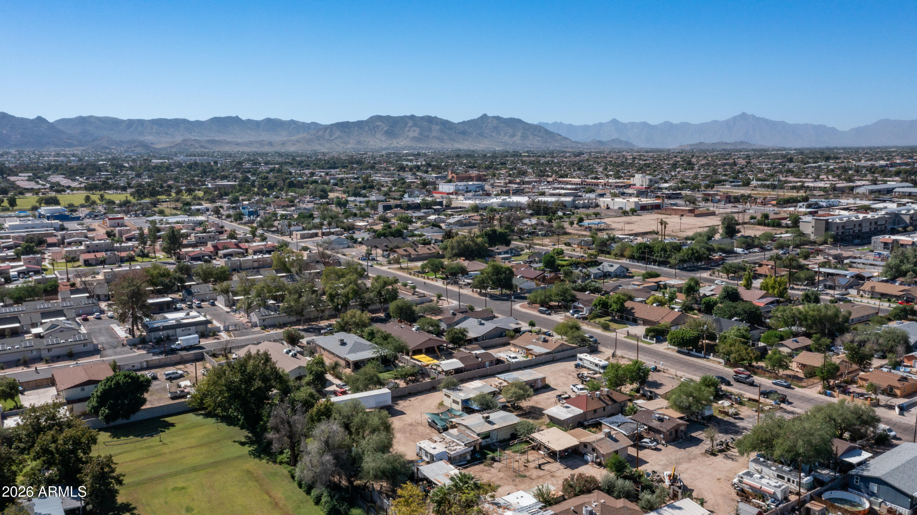 5437 South 4th Street Phoenix, AZ 85040 - Photo 9 of 28 an aerial view of residential houses with outdoor space and trees