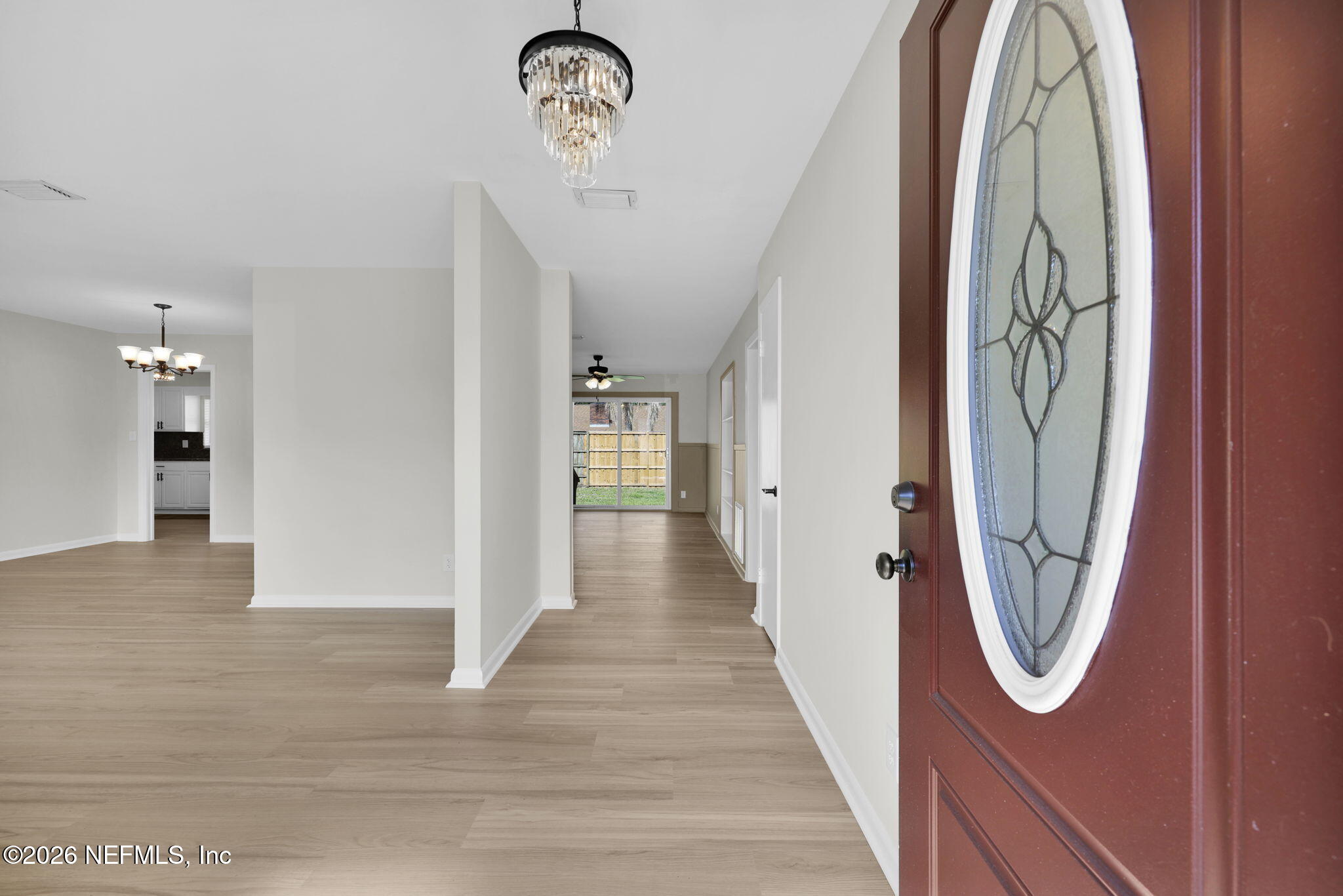 8544 Sanchez Road Jacksonville, FL 32217 - Photo 7 of 46 a view of a hallway with wooden floor and a hallway