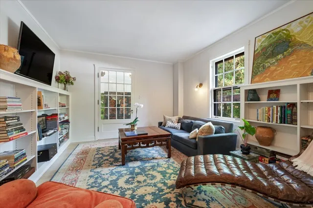 a living room with furniture fireplace and flat screen tv