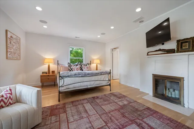 a white bath tub sitting next to a window