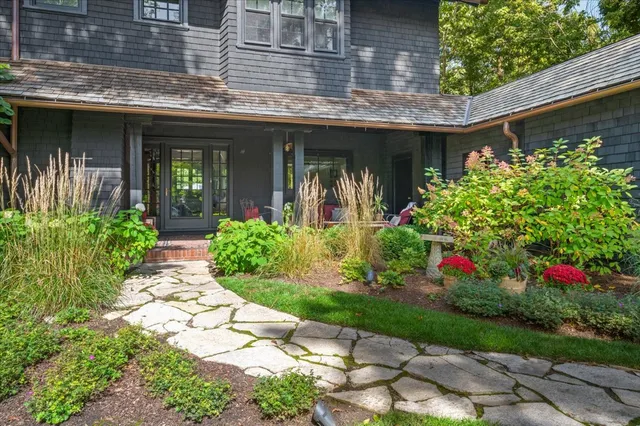 a front view of a house with a porch
