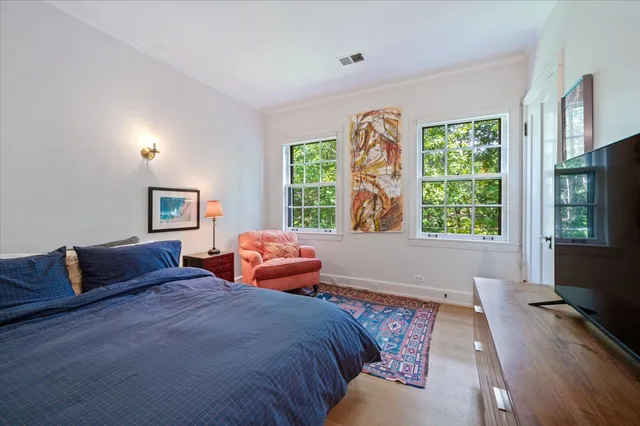 a view of a patio with couches chairs under an umbrella