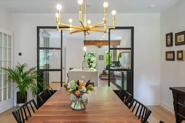 a dining room with furniture a livingroom and chandelier