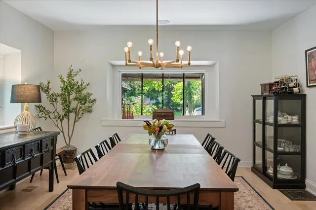 a view of a dining room with furniture window and outside view