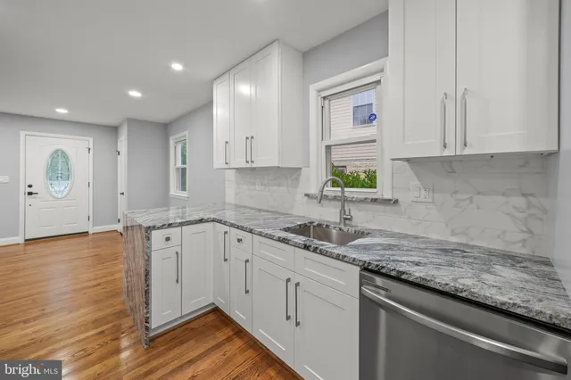 a kitchen with sink cabinets and window