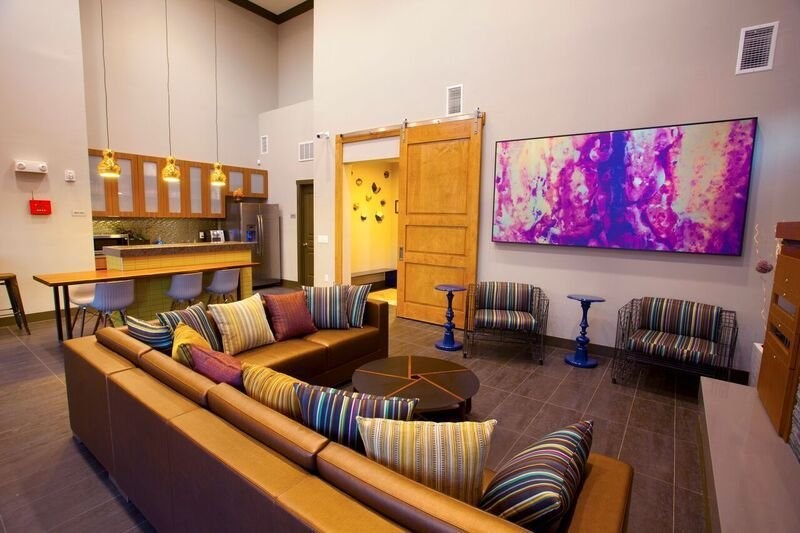 817 Colcord Avenue Waco, TX 76707 - Photo 13 of 15 a living room with furniture and a flat screen tv