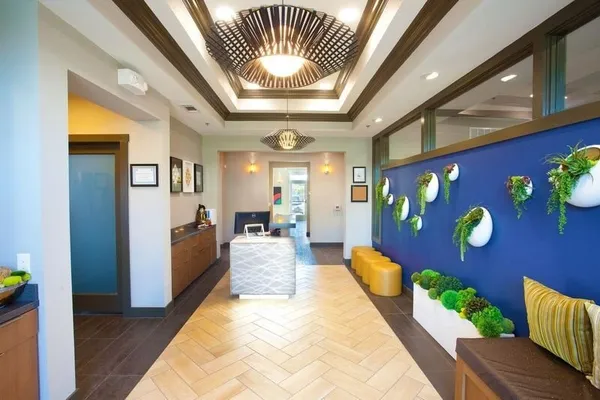 a lobby with furniture and a large window