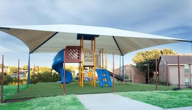 a front view of house with a garden