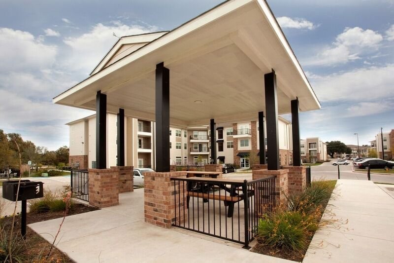 817 Colcord Avenue Waco, TX 76707 - Photo 9 of 15 a view of a patio with couches table and chairs and potted plants