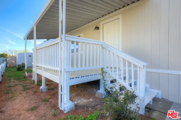 a view of a porch with a yard