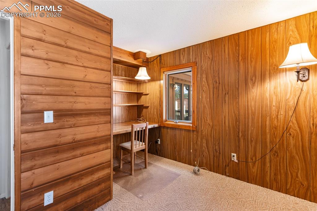 351 Porphry Road Florissant, CO 80816 - Photo 21 of 43 Office with built in shelves and desk