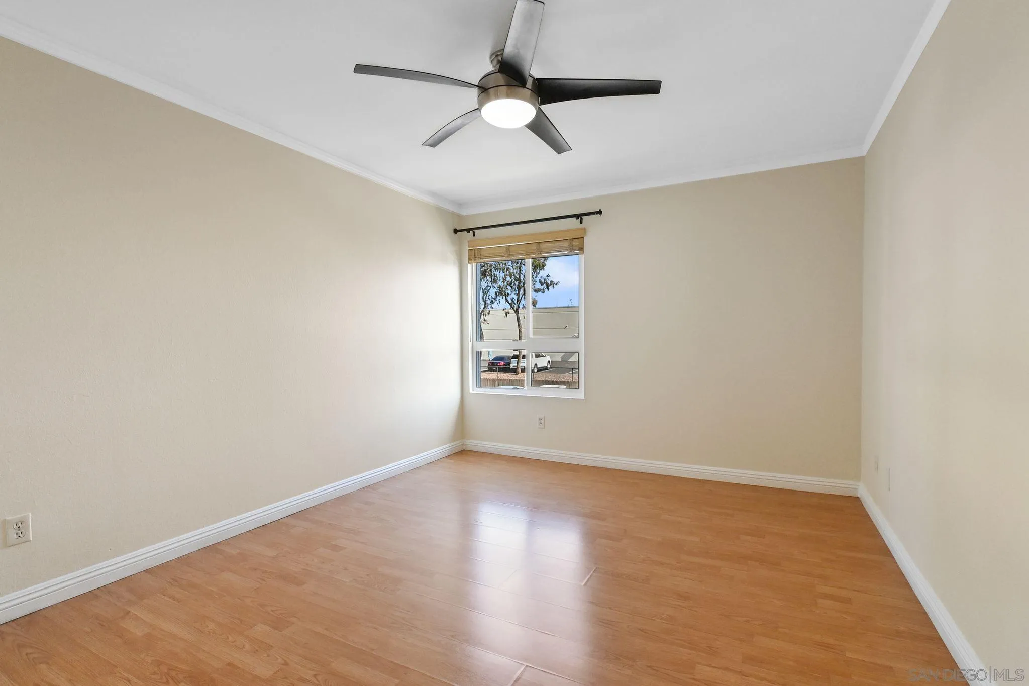 3550 Ruffin Road, Unit 235 San Diego, CA 92123 - Photo 13 of 26 an empty room with a window and a ceiling fan