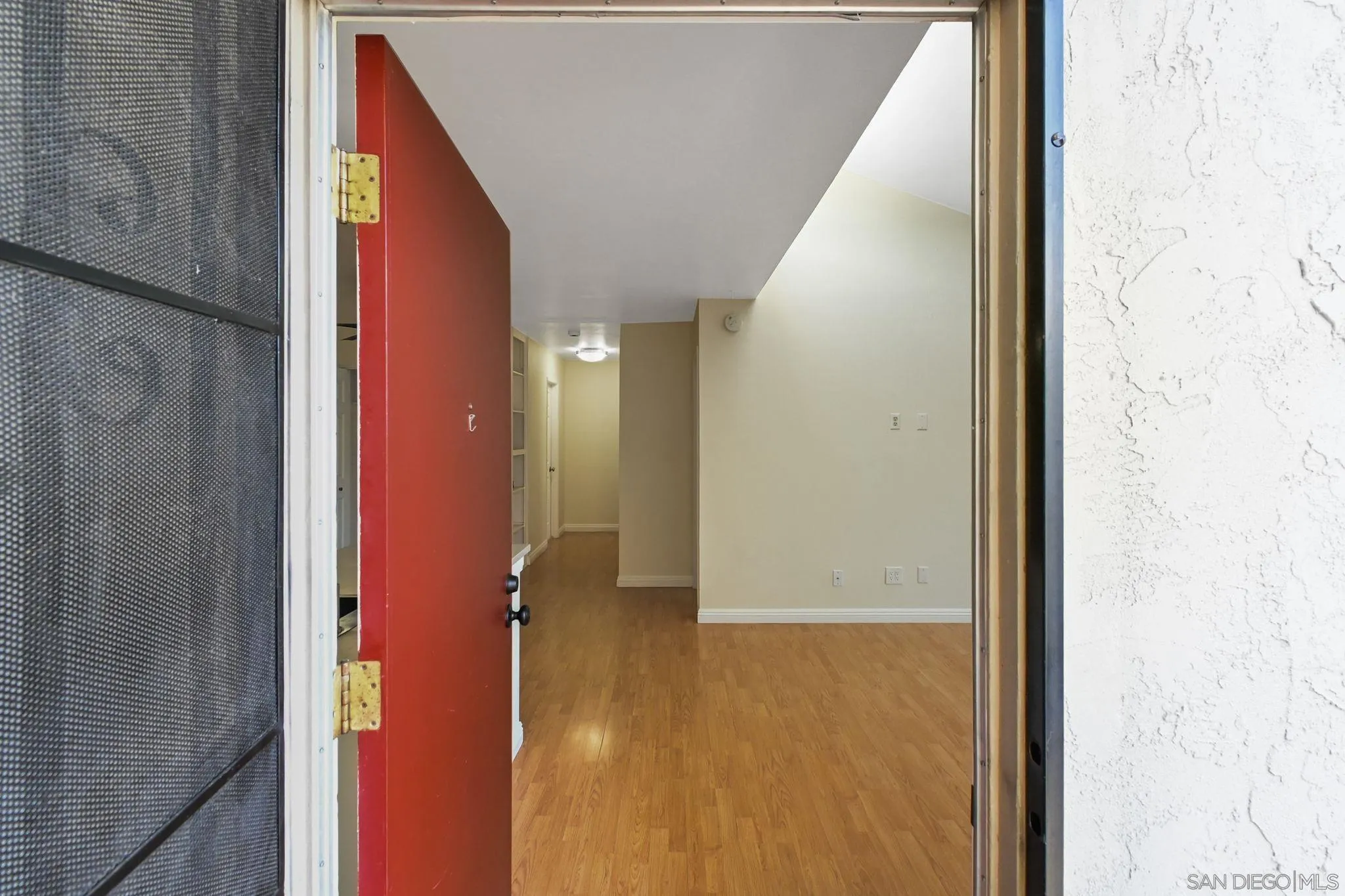 3550 Ruffin Road, Unit 235 San Diego, CA 92123 - Photo 20 of 26 a view of a hallway with wooden floor and entryway