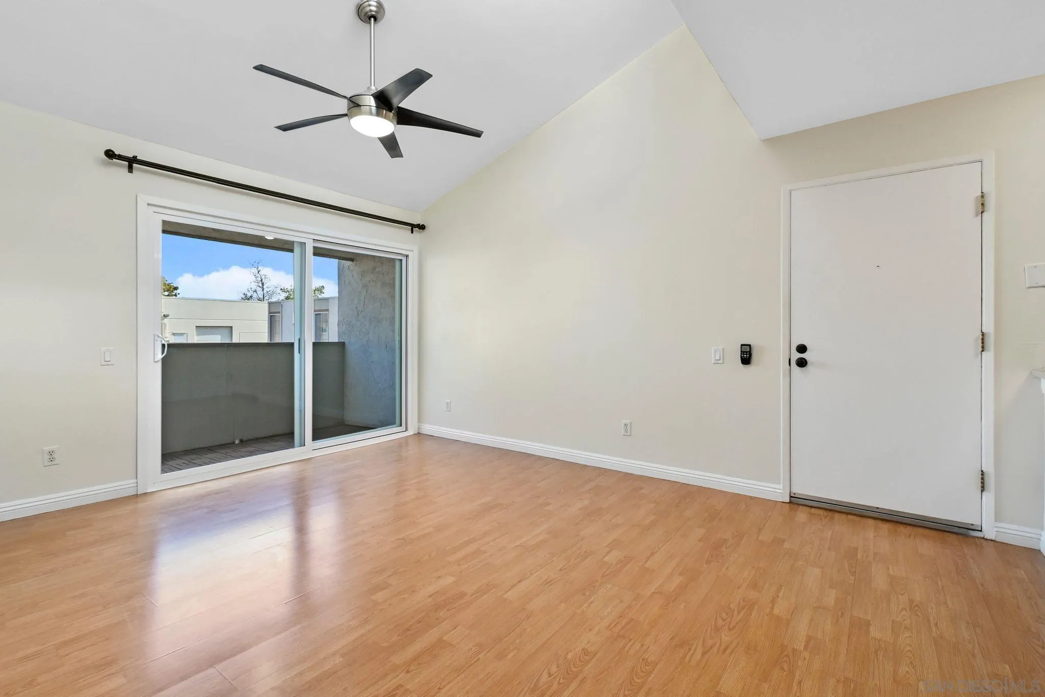 3550 Ruffin Road, Unit 235 San Diego, CA 92123 - Photo 2 of 26 a view of an empty room with a ceiling fan
