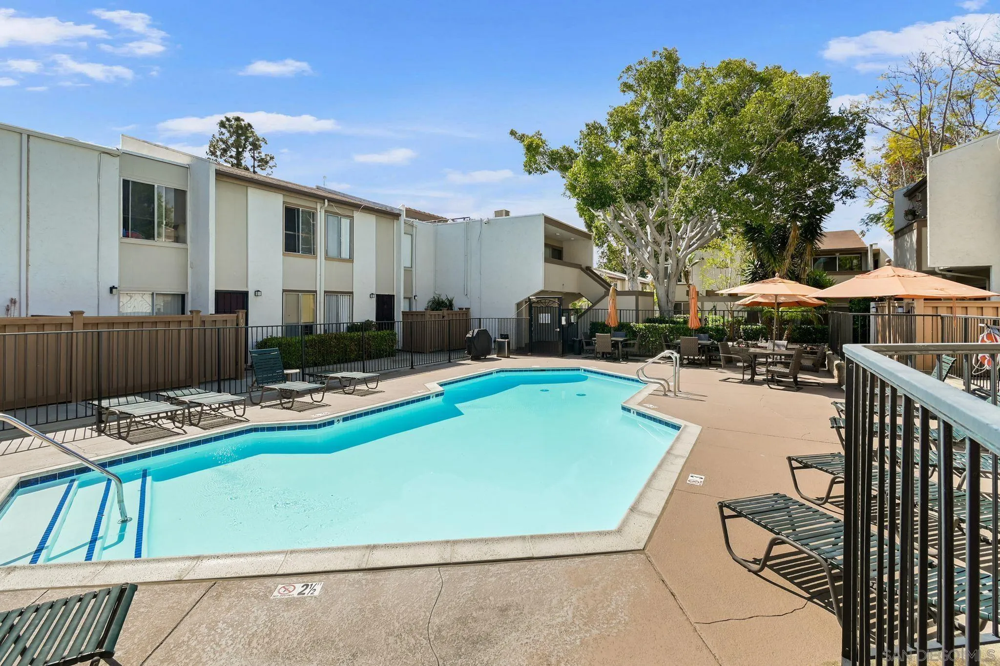 3550 Ruffin Road, Unit 235 San Diego, CA 92123 - Photo 22 of 26 a view of swimming pool with outdoor seating