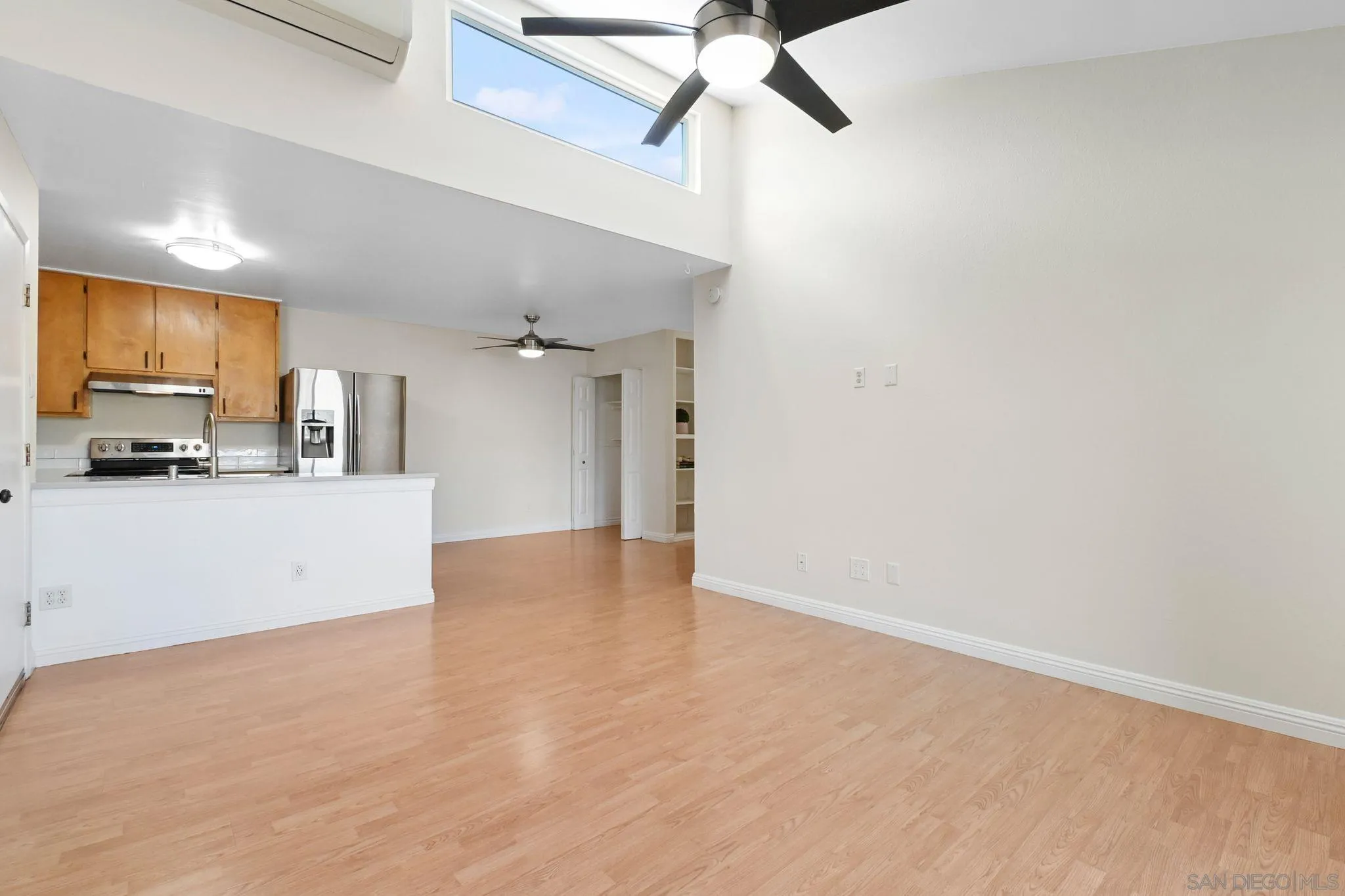 3550 Ruffin Road, Unit 235 San Diego, CA 92123 - Photo 8 of 26 a view of a kitchen with a sink and cabinets