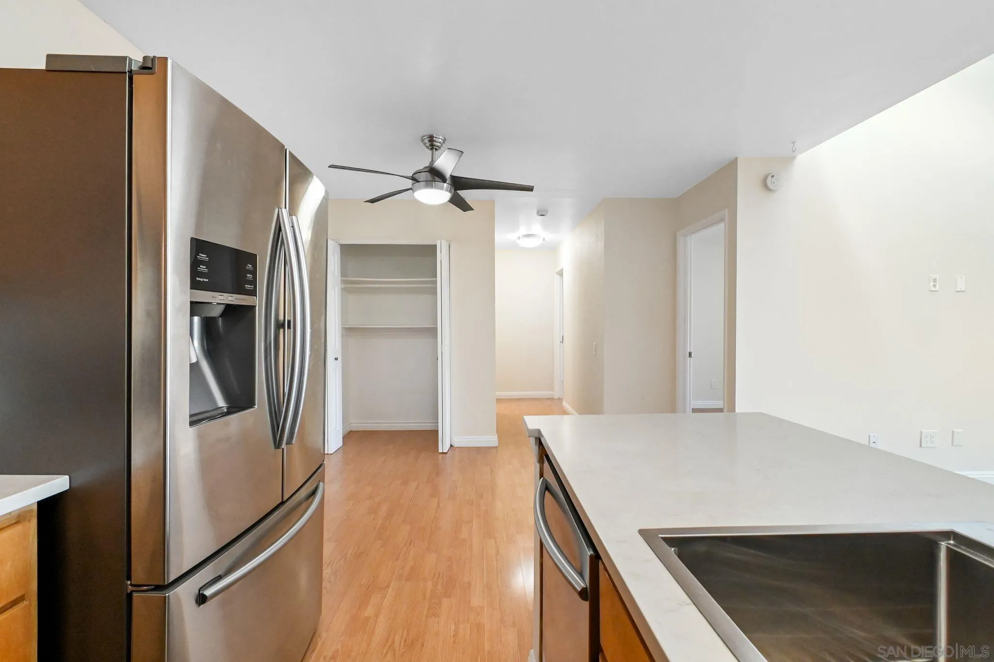 3550 Ruffin Road, Unit 235 San Diego, CA 92123 - Photo 10 of 26 a view of a kitchen cabinets and wooden floor